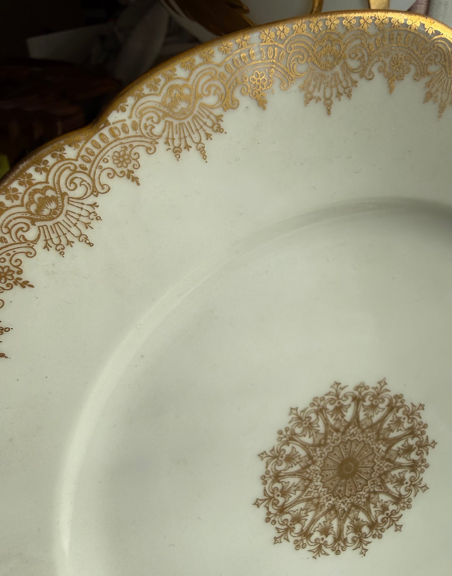 Limoges plates Gold trim & center emblem 8 available 5 great, 3 chips